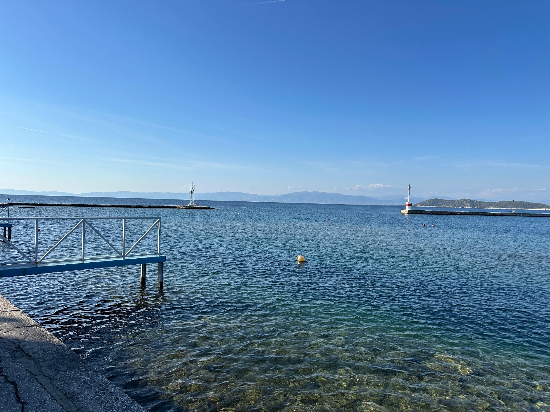 Calm water, far mountains